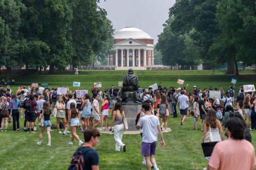 Students at a fair in front of the Rotunda