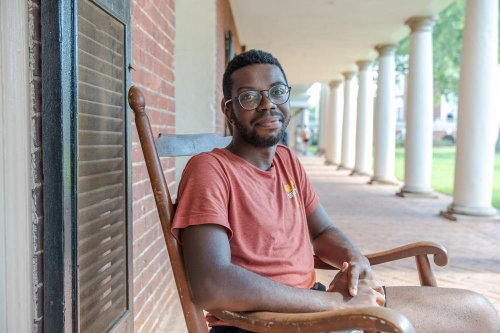Student in chair on the Lawn