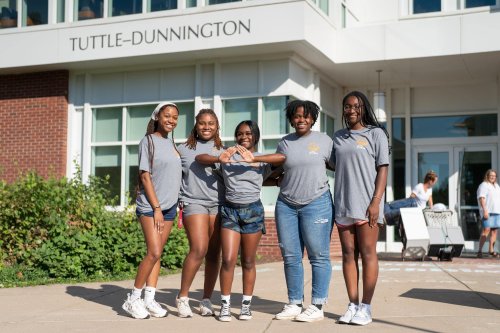 Students in front of dorm