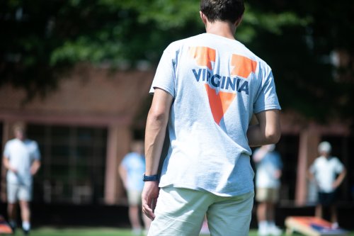 Young man wearing split V t shirt viewed from the back