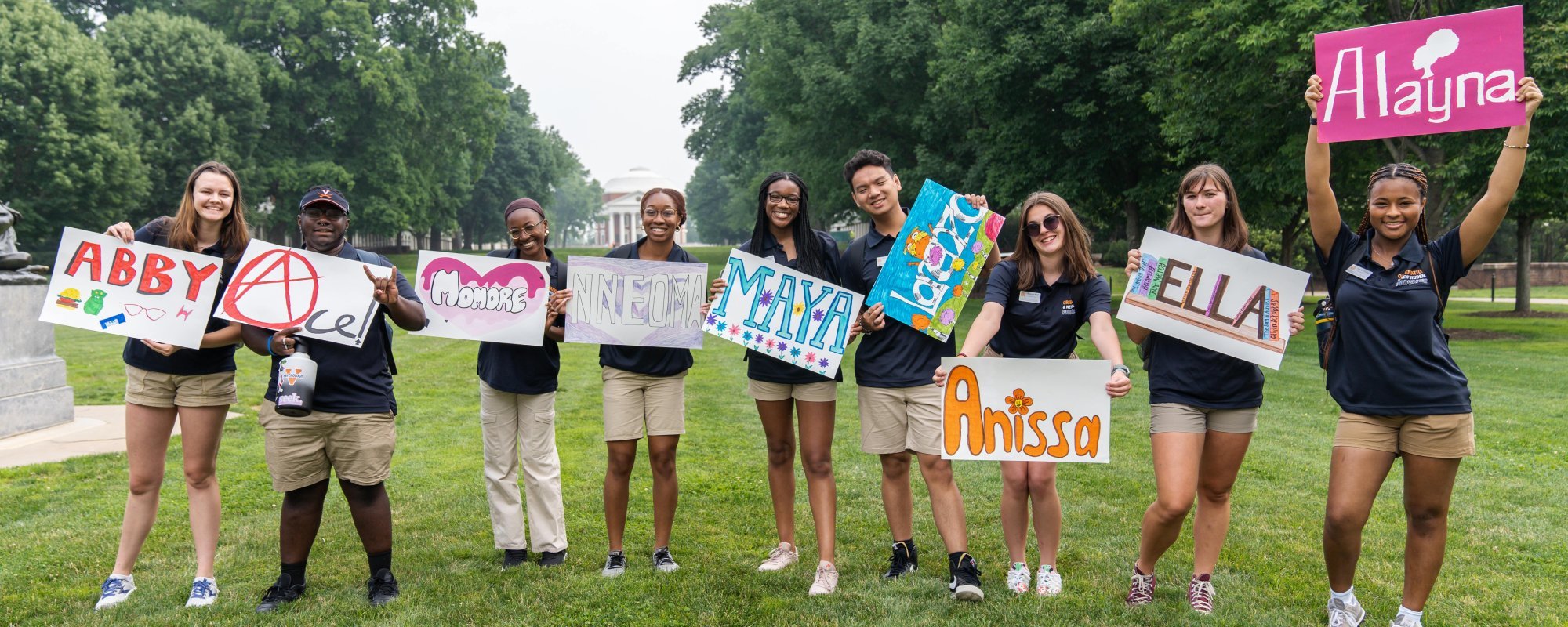 Summer Orientation leaders holding signs