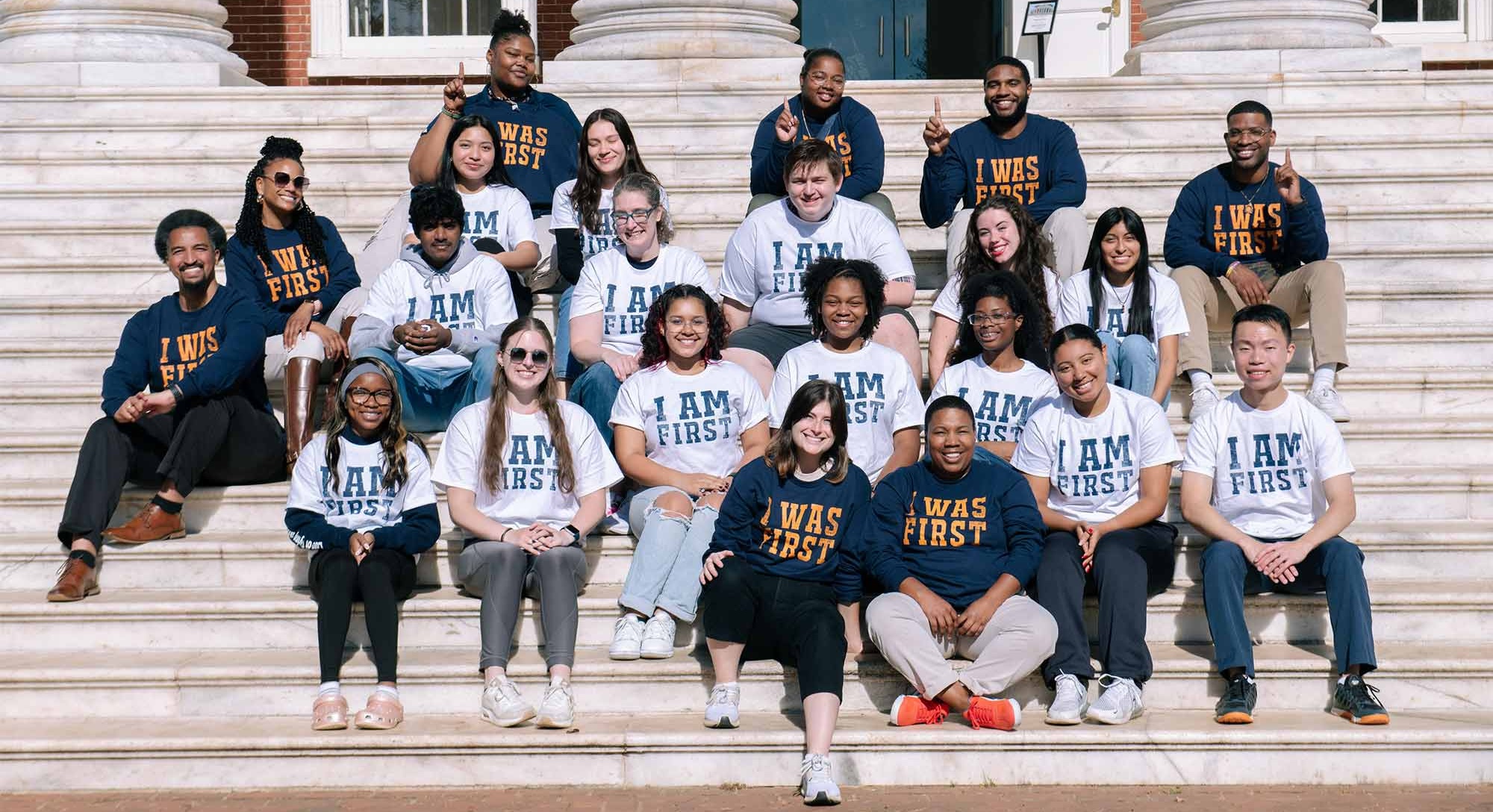 Group on Rotunda north steps wearing "I Was First" and "I Am First" T shirts