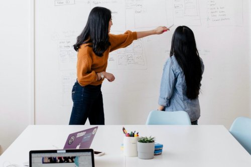 Students using a whiteboard